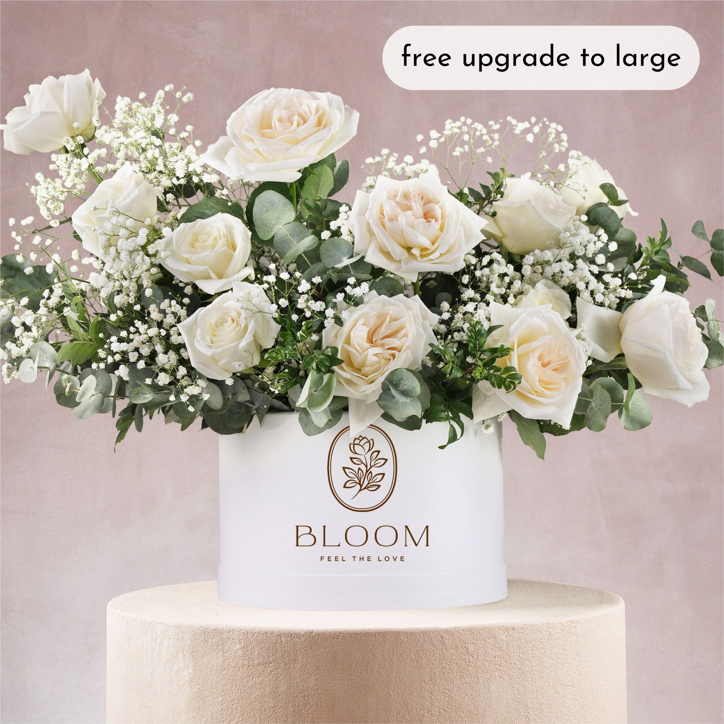 White hatbox flower arrangement Bloom Marbella featuring white roses and greenery in elegant white container
