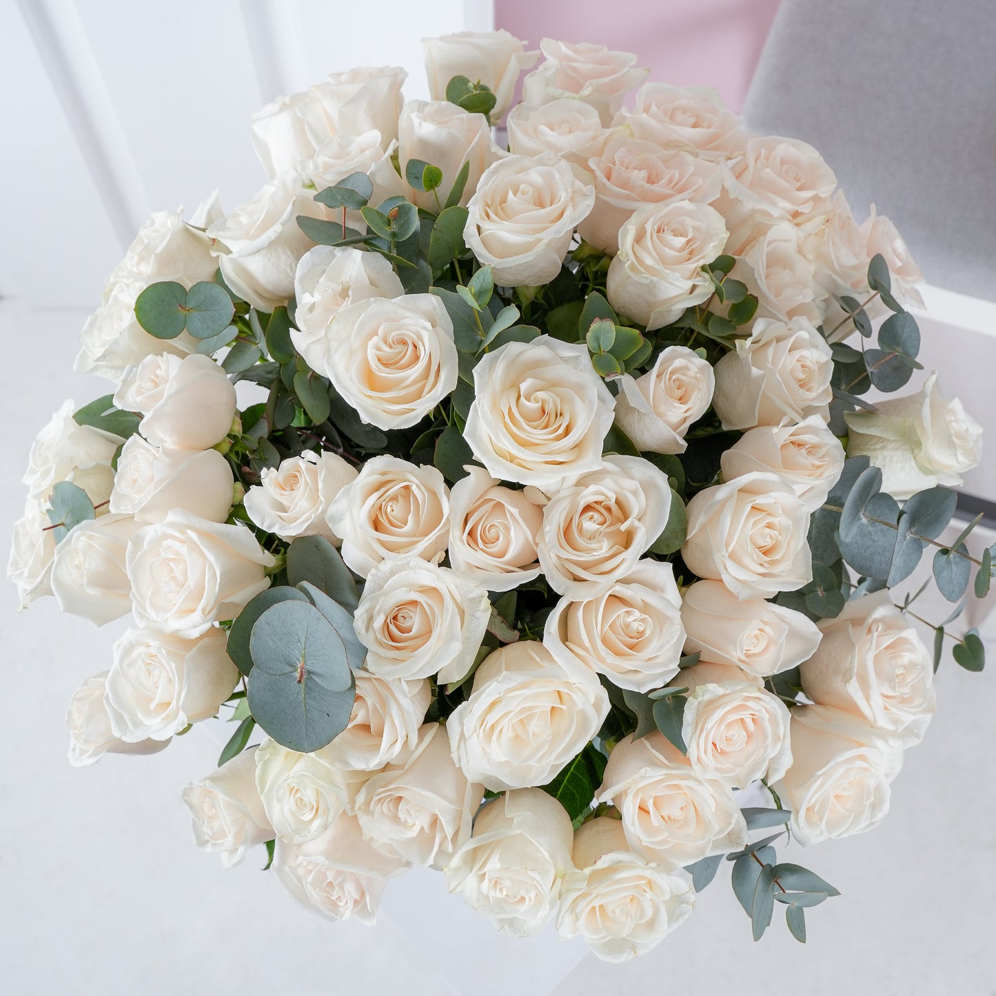 White roses bouquet Marbella arranged with green eucalyptus leaves by Bloom Marbella