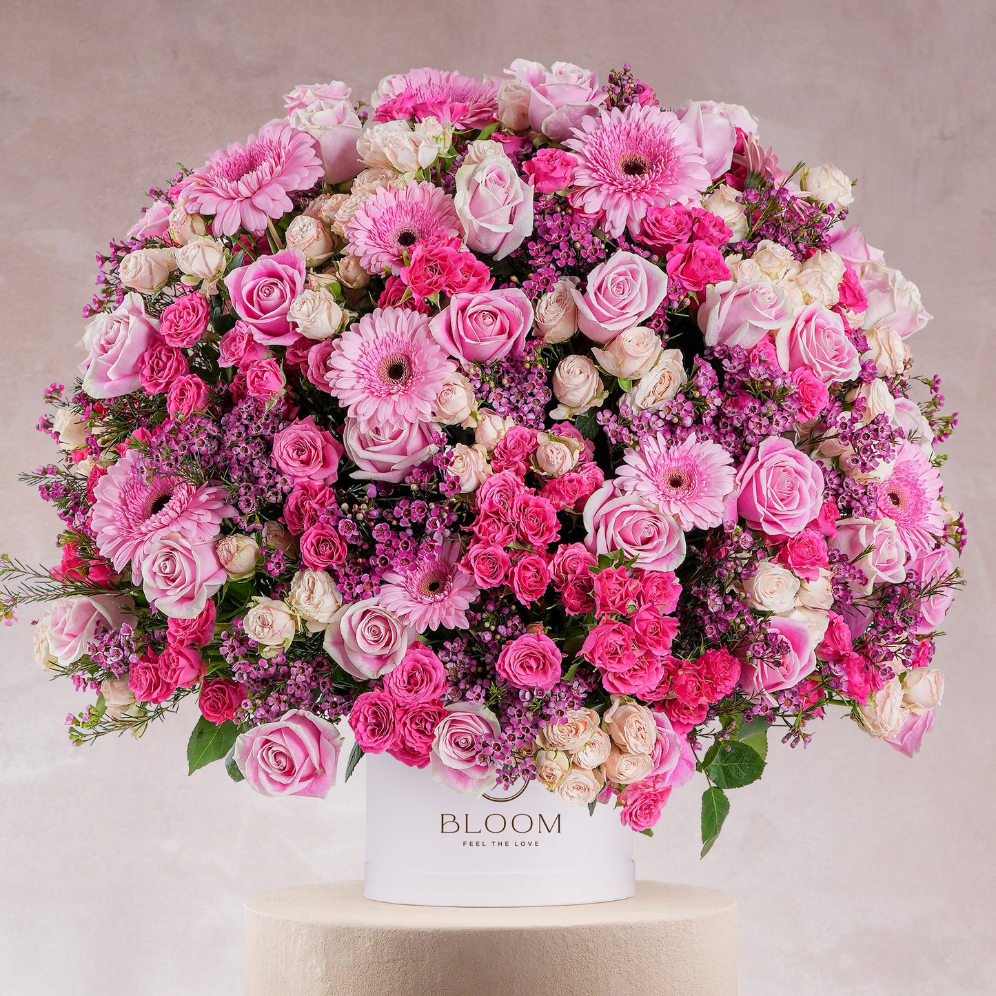 Coraline hatbox flower arrangement by Bloom Marbella with pink roses gerberas and carnations in white hatbox