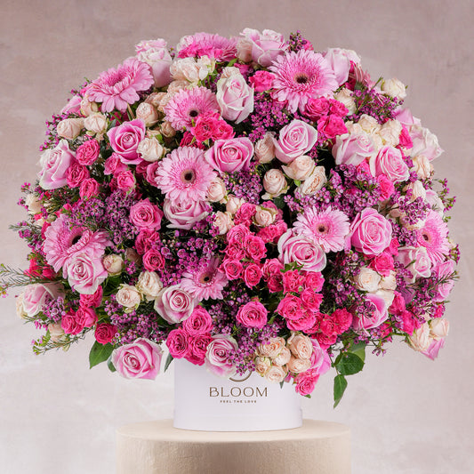 Coraline hatbox flower arrangement by Bloom Marbella with pink roses gerberas and carnations in white hatbox