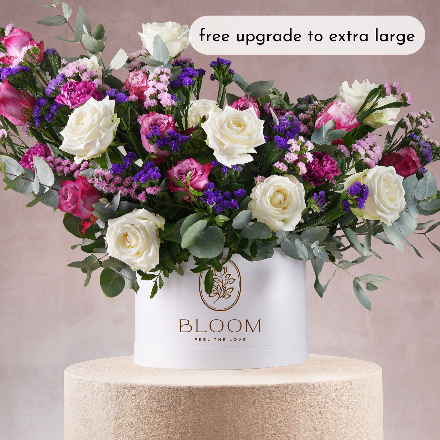 Lavender hatbox flowers Marbella bouquet with white roses pink carnations and purple accents in a Bloom Marbella container