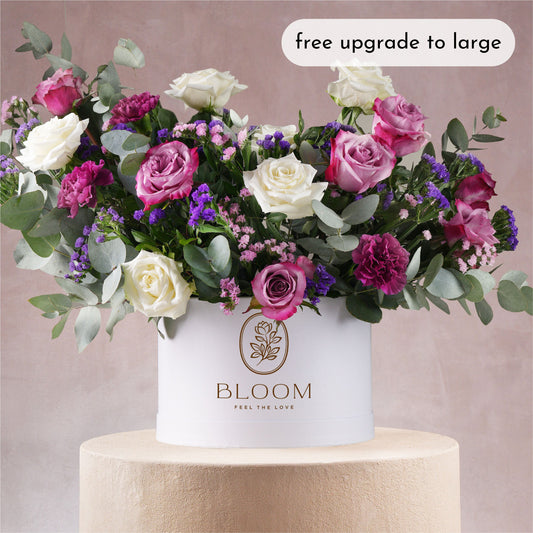 Lavender hatbox flowers Marbella arrangement by Bloom Marbella with white and purple roses in a white round box