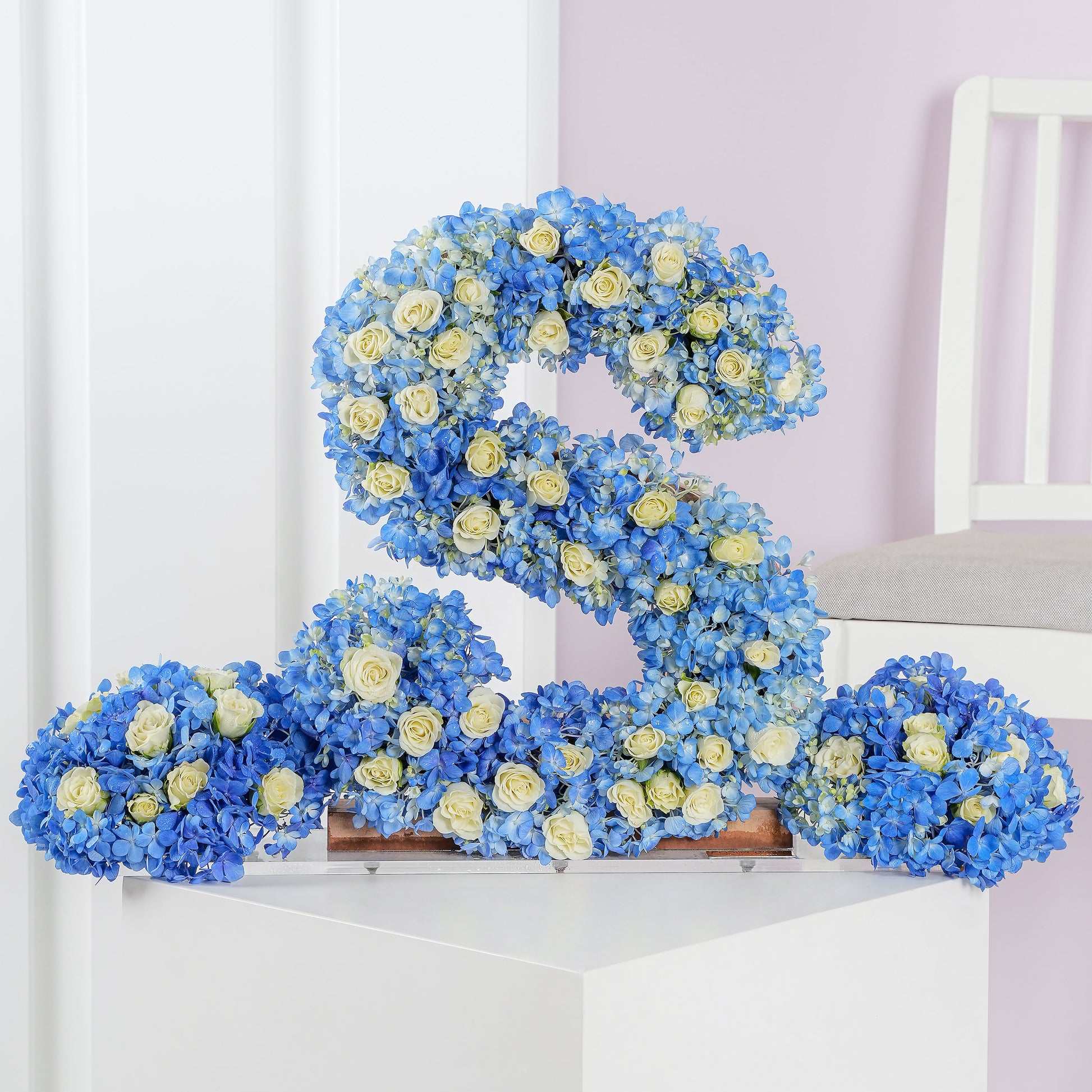 Deluxe letter flower arrangements shaped as letter S with blue hydrangeas and white roses by Bloom Marbella