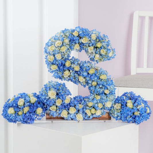 Deluxe letter flower arrangements shaped as letter S with blue hydrangeas and white roses by Bloom Marbella