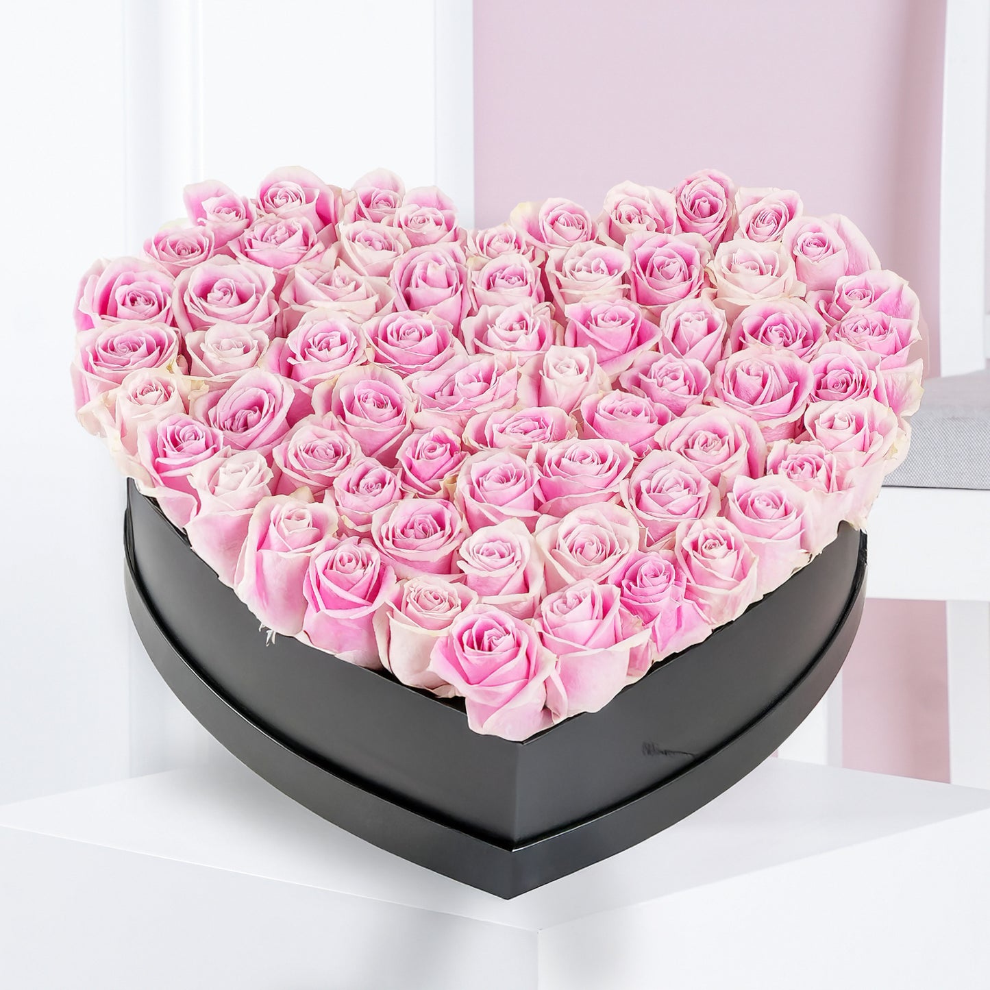 Heart shaped rose arrangement of pink and white roses in a black box by Bloom Marbella