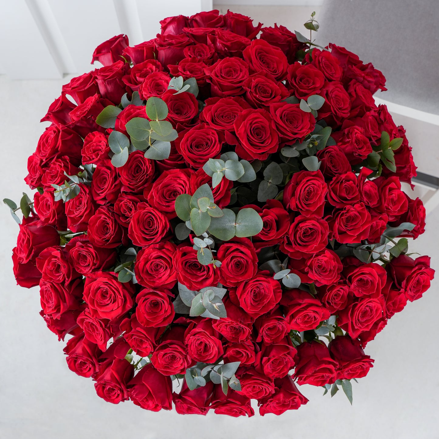 100 red roses bouquet Marbella with lush green leaves from Bloom Marbella florist
