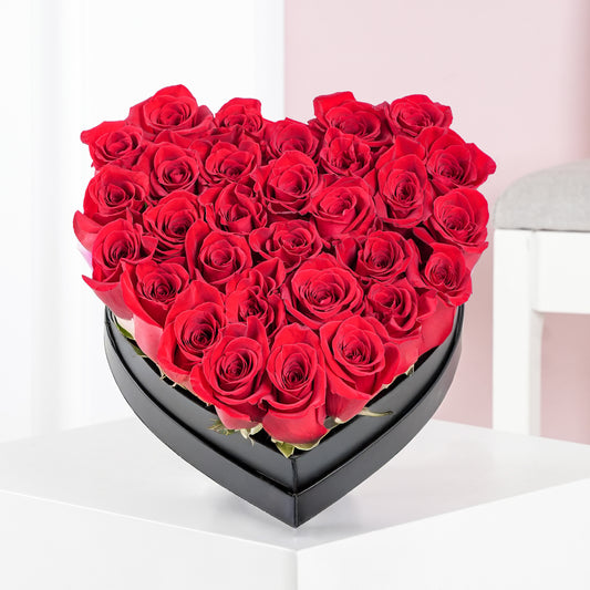 Red rose heart box Bloom Marbella with fresh vibrant red roses in a black heart-shaped container